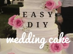 a white wedding cake with pink flowers on it and the words, easy diy wedding cake