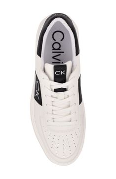 A logo heel adds brand-signature style to a low-top sneaker built with foam cushioning and arch support for all-day comfort. Synthetic upper, lining and sole Imported Low-top Logo Print Sneakers For Athleisure, Low-top Athleisure Sneakers With Logo Print, Modern Low-top Sneakers With Logo, Modern Low-top Logo Sneakers, Athleisure Sneakers With Logo Print And Round Toe, Low-top Logo Sneakers In Athleisure Style, Low-top Logo Sneakers For Athleisure, Modern Sneakers With Embossed Logo And Round Toe, Leather Mid-top Sneakers With Logo