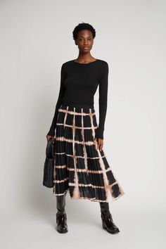 This midi skirt emits a leisurely, yet, elegant style with its intricate pleat detailing and elastic waistband. Suitable for work or play, the skirt’s beautiful all-over print can be balanced out with a relaxed knit or turtleneck for an elevated look or a slim-fit tee for more casual styling. Details: The model is 5’ 8” and wears a size 36 Fit: Regular / Midi long Munthe aims to produce printed styles with a minimum of waste in mind. This means that every style has small differences in how the p Workwear Midi Length Pleated Skirt With Elastic Waistband, Pleated Midi Skirt With Elastic Waistband For Work, Chic Midi-length Pleated Skirt With Elastic Waistband, Chic Midi Length Pleated Skirt With Elastic Waistband, Fall Viscose Midi Skirt, Relaxed Viscose Skirt For Fall, Fall Midi Skirt In Viscose, Chic Pleated Waist Maxi Skirt For Fall, Chic Fall Maxi Skirt With Pleated Waist