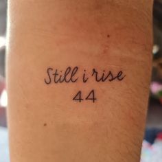 a tattoo that reads still i rise 4 / 4