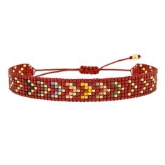 a red beaded bracelet with multicolored beads and gold accents on the clasp