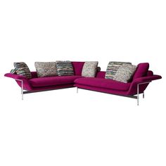 a purple couch with pillows on it