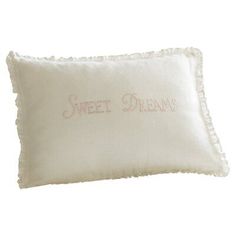 a white pillow with the words sweet dreams embroidered on it's front and back