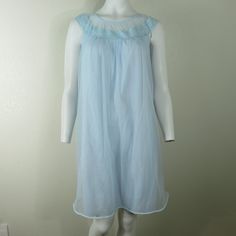 "LOVELY AND FEMININE WITH TONS OF VINTAGE CHARM Vanity Fair Vintage Chiffon Short Nightgown in Light Blue Two layers of nylon Especially Pretty Lace Made in the USA Size: Small 36\" length (shoulder to hem) 38\" bust (19\" seam to seam) Wonderful Vintage Condition item#0225/098897" Sheer Sleeveless Nightgown For Sleep, Vintage Blue Sheer Sleepwear, Vintage Sheer Sleeveless Sleepwear, Blue Sheer Vintage Sleepwear, Vintage Sleeveless Sheer Sleepwear, Sleeveless Blue Nightgown With Lace Trim, Light Blue Sheer Dress For Daywear, Sheer Sleeveless Sleepwear For Summer, Blue Sheer Sleeveless Nightgown