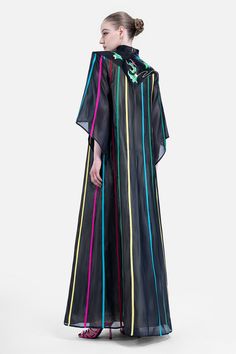 Indulge in pure elegance with our dress. Crafted from luxurious organza, this dress boasts a straight v-neckline and a floor length silhouette that will leave you feeling like a work of art. Elevate your style with this exclusive piece. Elegant Multicolor Maxi Length Kaftan, Silk V-neck Kaftan For Formal Occasions, Black Spring Kaftan For Evening Wear, Elegant Multicolor Silk Gown, Black Spring Evening Kaftan, Black Organza Maxi Dress, Black Silk Maxi Length Kaftan, Black Silk Maxi Kaftan, Elegant Multicolor Floor-length Kaftan