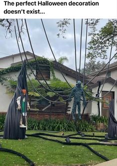 sculptures in front of a house with power lines running through the yard and on top of them