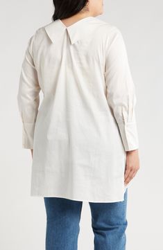 An asymmetric collar and long sleeves frame this crisp cotton tunic finished with a high-low hem. 33 1/2" length Two-button closure Spread collar Long sleeves High-low hem 100% cotton Machine wash, dry flat Made in Turkey Long Sleeve Tunic With Placket For Work, Cotton Tunic With Buttons For Daywear, Oversized Cotton Top With Asymmetrical Hem, Fitted Cotton Asymmetrical Shirt, Cotton Button-up Tunic For Daywear, Oversized Asymmetrical Cotton Shirt, White Asymmetrical Cotton Shirt, High Low Hem, Nordstrom Store