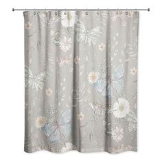 a pink shower curtain with butterflies and flowers on the outside, in front of a white background