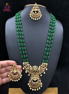 High quality semiprecious color beaded necklace 20 inch length with awesome traditional temple design floral pendant studded with CZ ad stones and emerald ruby stones. The pendant set comes with matching pair of earrings. Rubies Jewelry, Long Bead Necklace, Ruby Jewelry Necklaces, Indian Necklace, Bollywood Jewelry, Long Beaded Necklace, Floral Pendant, Indian Bollywood, Kundan Necklaces