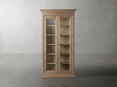 a tall wooden bookcase sitting on top of a floor