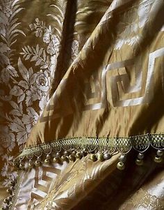 a close up of a curtain with beads on it