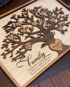 a wooden family tree with hearts on it