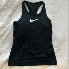 Never Worn Can Fit Womens Xsmall Black Fitted Tank Top For Running, Fitted Black Tank Top For Running, Basic Black Racerback Top, Casual Black Tank Top For Running, Nike Black Running Top, Nike Fitted Tops For Running, Nike Fitted Running Tops, Nike Black Sporty Tank Top, Nike Black Training Tops