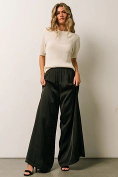 Step up your style with the new Jayla Palazzo Satin Pants in Black! These sleek business casual pants will add some fun to your wardrobe. Black Satin Pants Outfit Work, Black Satin Wide Leg Pants Outfit, Black Silky Pants Outfit, Wide Leg Satin Pants Outfit, Black Silk Pants Outfit, Black Flowy Pants Outfit, Silky Pants Outfit, Black Satin Pants Outfit, Black Pants Outfit Dressy