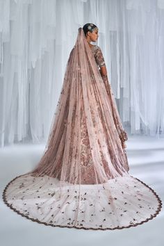 Raw silk bridal lehenga with thread and zardosi embroidery with a tulle dupatta and a tulle head veil. Embroidered blouse. Wedding Lehenga With Sheer Dupatta, Bollywood Hand Embellished Dupatta For Traditional Ceremonies, Hand Embellished Sharara For Traditional Ceremonies, Hand Embellished Traditional Sharara For Ceremonies, Traditional Gown With Sheer Dupatta For Ceremonies, Sheer Dupatta Gown For Traditional Ceremonies, Wedding Sharara With Sheer Dupatta, Traditional Drape Gown With Dupatta For Ceremonies, Wedding Sharara With Sheer Dupatta In Traditional Drape