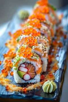 a sushi roll on a blue plate topped with cauliflower