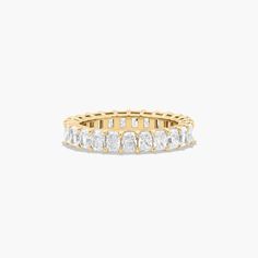 This timeless eternity ring features the boldness and intense sparkle of radiant cut diamonds. A classic, tailored shared prongs setting allows the maximum amount of the diamonds surface to show. *Number of diamonds and carat total weight will vary depending on ring size. Luxury Heirloom Diamond Cut Eternity Band, Luxury Heirloom Eternity Band With Diamond Cut, Luxury Yellow Gold Eternity Band For Wedding, Luxury Heirloom Eternity Band For Engagement, Luxury Yellow Gold Half Eternity Wedding And Engagement, Luxury Yellow Gold Eternity Band For Formal Occasions, Luxury Stackable Yellow Gold Eternity Band, Luxury Gold Eternity Band For Formal Occasions, Luxury Classic Yellow Gold Eternity Band