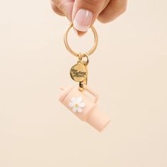 This Tiny Tumbler Keychain is an easy way to brighten up your essentials. Crafted from lightweight material, it features a gold detail keychain and flower detail on the front. Available in 6 attractive colors (Navy, Sandstone, Aqua, Pink, Oat, and Green), it's sure to be the perfect complement to any bag or wristlet. Features: Lightweight material Gold detail keychain Flower detail on front of tumbler Keychain Product Photography, Keychain Photography Ideas, Cute Keychain Aesthetic, Keychain Photography, Lip Balm Keychain, Aesthetic Keychain, Saving Account, Keychain Aesthetic, Silicone Keychain