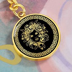 "This Medusa Keychain Is the Perfect Gift Whether for Yourself or a Loved One.  Explore all our Inspirational jewelry here: https://www.etsy.com/in-en/shop/SymbolicPresent?ref=seller-platform-mcnav&section_id=31033166 ➜ Our jewelry is made of high-quality surgical steel with a shatterproof liquid glass coating and an 18k gold finish option. ➜ Engrave onto the back of the Medusa Keyring your loved one's name, your wedding date, an anniversary, or anything else you want to remember and keep you cl Gold Metal Keychain Perfect For Gifts, Gold Metal Keychain For Gift, Medusa Accessories, Luxury Mythological Pendant Necklace, Versace La Medusa Bag, Medusa Pendant, Versace Greek Key Ring, Medusa Head, Glass Coating