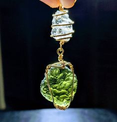 "🌠 GENUINE LARGE 2.6\" MOLDAVITE & Phenacite Necklace Hand Wrapped in 14 kt GOLD!🌠 Beautiful AUTHENTIC Green MOLDAVITE & Phenakite Necklace With GREAT Synergistic Energy! You will receive this exact ONE OF A KIND NECKLACE! The moldavite is from Chlum in the Czech Republic and the LARGE Phenacite is from Brazil! This is a Shine Crystals top selection! It comes with an awesome \"gunmetal\" colored chain (choose your length in the dropdown menu) made in our studio. We are so excited to offer this Gold Untreated Jewelry As A Gift, Tsavorite Pendant Jewelry As Gift, Green Untreated Collectible Jewelry, Green Wire Wrapped Jewelry For Anniversary, Witch Board, Moldavite Pendant, Moldavite Jewelry, Authenticity Certificate, Hand Wrap