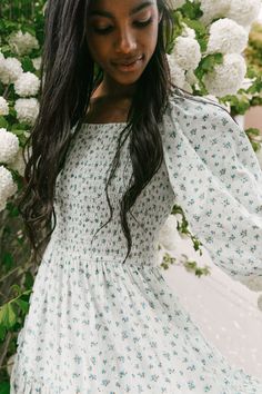 Flowy, feminine, and functional. Everything this carefree tea-length dress is made of. Inspired by enchanting beauty, the wind in your hair, and the celebration of being grounded to mother earth. Smocked bodice with puff sleeves and ruffle details. Dreamy muted blues and greens and a micro floral print. Matching Outfit Ideas, Ivy City Co, Bohemian Style Clothing, Mommy And Me Dresses, City Woman, Boho Style Outfits, Cottagecore Outfits, Night Dresses, Matching Outfit