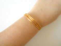 I will just say you NEED these in your life. Sparkly? Versatile? Stretchy? Check, check, check. Plus, it won't break your bank. These sparkly and delicate bracelets come in a set of 3. They are stretchy, made with sparkly gold seed bead and a delicate gold plated bar.Find more stretchy beaded bracelets right here: https://www.etsy.com/shop/StephanieMartinCo/search?search_query=stretchy+braceletℴ=date_desc&view_type=gallery&ref=shop_searchMatching necklaces available here: https://www.ets Gold Beads Stretch Bangle Bracelet As Gift, Dainty Gold Beaded Bangle Bracelets, Minimalist Yellow Gold Stretch Bracelet As Gift, Dainty Gold Beaded Bangle Bracelet, Stretch Bangle Bracelet With Tiny Beads For Gift, Bangle Stretch Bracelet With Tiny Beads For Gift, Gold Stretch Bracelet With Tiny Beads For Gift, Gold Minimalist Stretch Bracelet As Gift, Minimalist Gold Stretch Bracelet For Gift