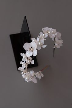 Bridal headband floral, White bridal headband, Flower tiara, Wedding headband for bride floral, White floral tiara, Brides floral tiara This exquisite wedding blossom headpiece is a perfect choice for a modern bride! It looks great even if you are keeping long curls or straight hair.  The accessory is attached to a silver headband for a secure fit. The flowers are made of UV resin, that is the new trend in handmade jewelry. Each petal is created manually.  - Is made to order - Flexible, easily adjustable, stiff enough to hold your hairstyle all-day - Possible to recreate any size and color  - Suits a range of hairstyles - Width of headband - 1.18 inches (3 cm) - Comes in a beautiful signature box. Custom orders are welcome! Feel free to contact us!! Please NOTE!! All of our products are ha Flower Tiara Wedding, Headband For Bride, Floral Tiara, Flower Tiara, Bead Hair Accessories, Bride Floral, Tiara Wedding, Silver Headband, Headband Flower