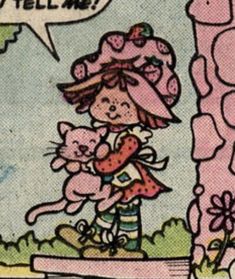 an old comic strip with a girl holding a cat and the caption hello kitty