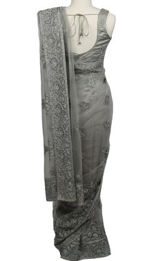 This dusty grey Saree makes a bold statement with tonal threadwork and shines with stone work throughout the Saree on an elegant net fabric.Top Length: 15Fabric: NetEmbroidery: Thread, StoneNote: Optional Sleeves Included Tonal Embroidery, Grey Saree, Embroidery Saree, Net Fabric, Stone Work, Flapper Dress, Gray Color, Bodycon Dress, Thread