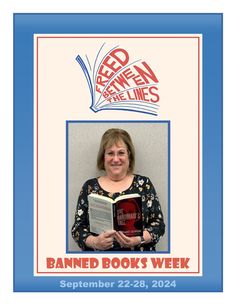 a woman holding a book in front of a sign that reads, banned books week