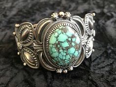 This bracelet is by the late very talented Navajo silversmith Kirk Smith. Heavy at81.4 grams. The silver work and the quality of the turquoise are amazing. Classic Handmade Turquoise Bracelets, Classic Round Turquoise Jewelry, Oval Turquoise Collectible Bracelet, Turquoise Bracelet Jewelry Collectible, Classic Turquoise Adjustable Bracelet, Turquoise Cabochon Bracelet, Turquoise Cabochon Round Bracelets, Turquoise Round Cabochon Bracelets, Turquoise Oval Bracelet