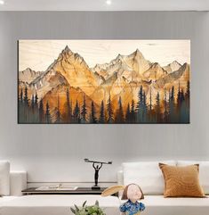 a living room with a painting on the wall and a couch in front of it