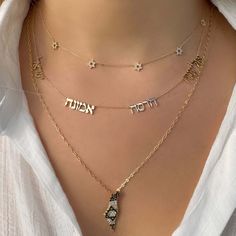 Enhance your everyday look with this exquisite 14K gold necklace featuring multiple personalized Hebrew nameplates. Choose the number of names you want on the chain and add a unique touch to your style. The perfect blend of luxury and personalization, this necklace is a must-have for those who appreciate fine jewelry. For personalization, enter the Hebrew name in the designated box. If you are unable to type in Hebrew, please use Google Translator to convert your name from English to Hebrew and Silver 14k Gold Necklaces With Names, Jewelry Stack, English To Hebrew, Elegant Beauty, Stacked Necklaces, Nameplate Necklace, Team Members, Popular Jewelry, 14k Gold Necklace