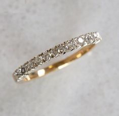 a wedding band with five diamonds on it