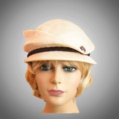 This charming ladies newsboy cap is hand draped on an antique wooden head form.  My hats have an inside adjustable ribbon for fine-tuning the fit,  please indicate your head size measurement when ordering. Comes with a hat box for safe storage. I personally create each hat one at a time, and no two are ever exactly the same.  My hats are 100% handmade using traditional Millinery techniques and the highest quality fabrics and details. Because of this, please allow 2-3 weeks before shipping, unless otherwise agreed upon. Fitted Beige Cloche Straw Hat, Fitted Beige Brimmed Cloche Hat, Elegant Beige Flat Cap, Beige Adjustable Traditional Hat, Elegant Beige Straw Hat, Chic Beige Straw Cloche Hat, Traditional Adjustable Beige Hat, Brimmed Beige Straw Cloche Hat, Beige Brimmed Straw Cloche Hat