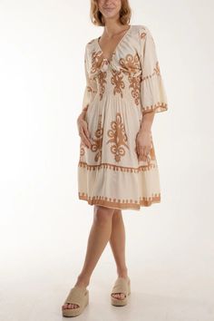 Step into sophistication with our Beige Printed Dress--an epitome of understated elegance. The oversized V-neck silhouette and alluring print make a bold statement. Meticulously crafted, this dress offers a comfortable and chic option for any occasion. The versatile beige hue adds a touch of warmth, making it suitable for both daytime and evening events. Whether paired with heels or flats, this midi dress ensures a stylish and relaxed look, perfect for those seeking a fashion-forward yet comfort Neutral V-neck Spring Dress, Beige Long Sleeve V-neck Dress For Summer, Beige V-neck Dress For Summer Beach, Flowy Dresses With 3/4 Sleeves For Vacation, Beige Long Sleeve Boho Beach Dress, Cream Long Sleeve Midi Beach Dress, Cream Long Sleeve Midi Dress For Beach, Cream V-neck Vacation Dress, Chic Beige V-neck Boho Dress