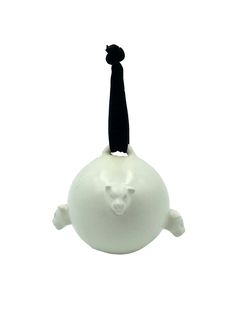 a white ball with a black cat on top