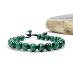 Malachite Beaded Bracelet This item is handmade by Earth's Minerals Inc and is made to order. This listing is for 1 (ONE) Malachite Beaded Bracelet Malachite absorbs negative energies and pollutants, picking them up from the atmosphere and from the body. Guards against radiation and clears electromagnetic pollution. Malachite clears and activates the chakras and attunes to spiritual guidance. It opens the heart to unconditional love. FOLLOW US ON INSTAGRAM @earthsmineralsinc Thank you ! Pictures Spiritual Malachite Beaded Bracelets For Healing, Spiritual Malachite Beaded Bracelet For Healing, Adjustable Agate Beaded Bracelets With Polished Beads, Adjustable Polished Beads Bracelets For Meditation, Adjustable Malachite Beaded Bracelets With Natural Stones, Handmade Malachite Spiritual Beaded Bracelets, Adjustable Malachite Spiritual Bracelet, Handmade Malachite Beaded Bracelets For Spiritual Use, Adjustable Spiritual Malachite Bracelets