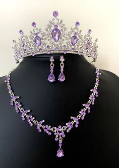 💜 Purple Baroque Bridal Tiara Set - Wedding Quinceanera Crown, Crystal Necklace and Earrings set for brides. Absolutely Stunning Crystal Bridal Necklace and matching earrings set with Purple Tiara!   💜 Luxury Wedding Headpiece encrusted with crystals. This jewelry set is perfect for your special day! Includes a Stunning Tiara, matching necklace, and earrings that are beautifully crafted into a silver setting. Combined with many clear crystal rhinestones!   💜 This beautiful necklace set will dazzle and add an extra elegant look to the bride on your wedding day! A delicate design that will make a statement on your special day such as wedding events/ceremonies.   💜 The design is distinctive and absolutely goes with everything. You will continue to enjoy them after your wedding!   💜 This Purple Flower Jewellery, Purple Prom Jewelry, Purple Tiara, Rapunzel Theme, Fairytale Wedding Decorations, Purple Quince, Quinceanera Jewelry, Quinceanera Crown, Wedding Accessories For Bride