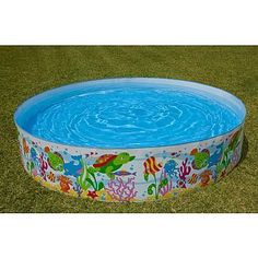 an inflatable swimming pool on the grass