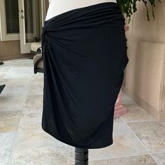 This Skirt Is Very Versatile, Can Be Dressed Up, Casual Or As A Beach Skirt, Ruched On The Side, And Very Flattering. In Excellent Preowned Condition, Never Worn And Like Nwot, Sz M. Black Draped Flowy Skirt, Black Flowy Draped Skirt, Black Ruched Draped Skirt, Black Draped Ruched Skirt, Draped Lined Skirt, Black Draped Ruched Bottoms, Relaxed Ruched Draped Skirt, Draped Gathered Skirt For Night Out, Ruched Draped Flowy Skirt