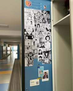 a blue door with pictures on it in a hallway next to a book shelf filled with books