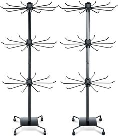 three black metal racks with wheels on them