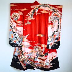 Authentic Japanese vintage kimono - Furisode, long sleeve kimono. Very gorgeously designed noshi bundle (auspicious strips of dried fish or seaweed). The Noshi pattern symbolizes longevity and is considered a lucky charm. Condition: There are minor spots as you can see in the last photo. But it's not very noticeable. This kimono is a preowned vintage item so cannot be expected to be in perfect condition. This gorgeous furisode kimono can be upcycled into a dress or various crafting ideas even if you don't want to wear it as a kimono. Approx.Size Length: 156cm Sleeve to sleeve: 125cm Back width: 58cm Sleeve length: 105cm Fully lined. Dry cleaning only. NOTE: The items are sold as is and we will not accept any return or exchange because of the aging signs and flaws. Please read the item desc Vintage Red Kimono For Tea Ceremony, Vintage Red Long Kimono, Vintage Long Red Kimono, Traditional Red Kimono For Tea Ceremony, Black Long Sleeve Kimono For Tea Ceremony, Long Sleeve Black Kimono For Tea Ceremony, Samurai Style Kimono For Tea Ceremony, Furisode Kimono, Dried Fish