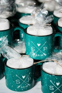 many green mugs with white frosting on them