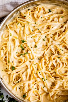 a large pot filled with pasta and parsley