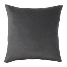 a gray pillow on a white background