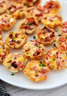 small appetizers are arranged on a white plate