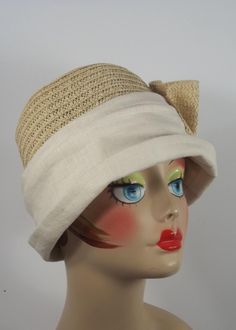 Please, read full description - click on LEARN more... after this paragraph. - vintage looking cloche hat, - natural color straw and cream linen, - decorated with a large Art Deco-style straw fan and a large linen covered button, - partially lined, the dome remains unlined and airy, - fold-able, - spot clean only, - sizes S,M,L. Your head's circumference: 21.5 inches - size S. 22.5 inches - size M. 23.5 inches - size L. SHIPPING is free in USA. Processing time 3-5 days before shipping. Ships by Vintage Beige Cloche Hat For Summer, Adjustable Vintage Cream Cloche Hat, Adjustable Beige Vintage Cloche Hat, Adjustable Cloche Flapper Hat, Vintage Cream Wide-brim Straw Hat, Ladies Hat, Church Hat, Hat Women, 1920s Art