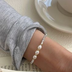 Color: Silver Fashion Element: Pearl Style: Affordable luxury style Elegant White Alloy Bracelets, White Alloy Bangle Bracelet, White Alloy Bracelets For Party, White Metal Pearl Bangle Bracelet, Elegant White Pearl Metal Bracelet, Trendy White Alloy Bracelets, Trendy White Alloy Bracelet, Adjustable Trendy Pearl White Jewelry, Elegant Alloy Beaded Bracelet